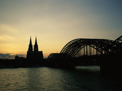 The Cologne Cathedral and Hohenzollern Bridge Silhouetted at Dusk