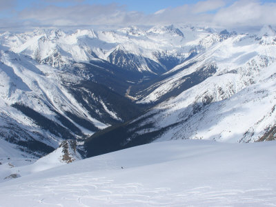 Buy A Back-Country Snowboarder Descends a Snowfield Near Rogers Pass at AllPosters.com