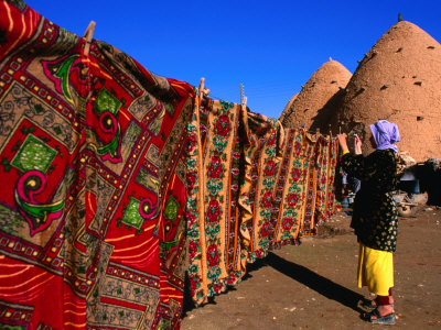 Bedouin Girl Hanging the Laundry Outside Mud-Built "Beehive" Houses, as Srouj, Syria