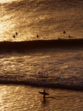 Surfers Riding Waves on the Bukit Badung Peninsula, Bali, Indonesia