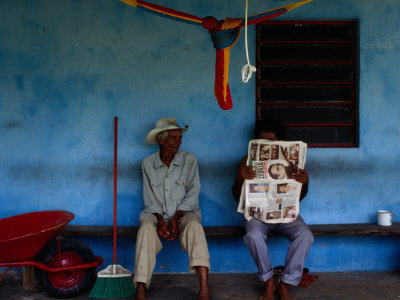 Coconut Farmers Sitting on Porch in Chichicapa, Mexico