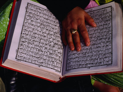 Hand Resting on Open Koran (Qaran), Delhi, India