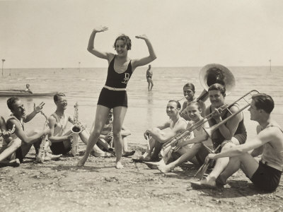 A Young Woman, Surrounded by Musicians, Dances on a Beach of the Lido of Venice