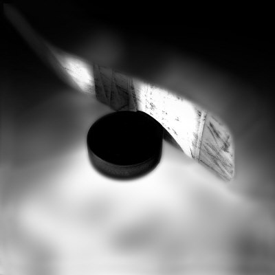 Extreme Close-up of a Hockey Stick and Puck Poster