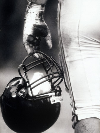 Buy Low Angle View of An American Football Player Holding a Helmet at AllPosters.com