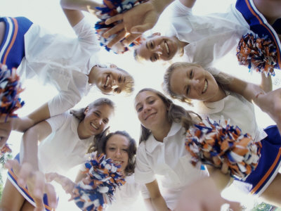Low Angle View of a Group of Cheerleaders Smiling Poster