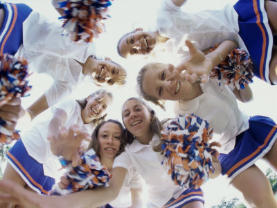 Low Angle View of a Group of Cheerleaders Smiling Poster