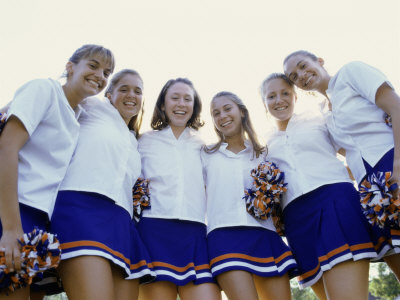 Low Angle View of a Group of Cheerleaders Smiling Poster
