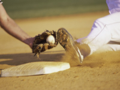 Baseball Player Sliding at a Base, and a Gloved Hand Holding a Ball Poster