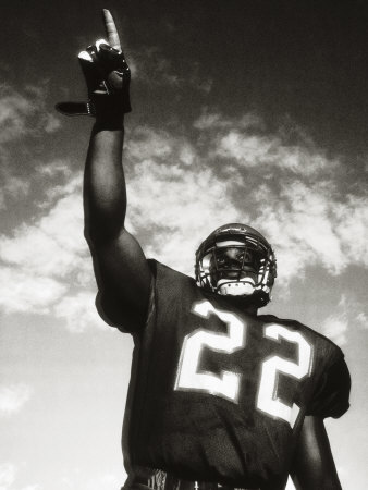 Low Angle View of an American Football Player Pointing Up Poster