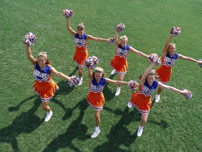 High Angle View of a Group of Cheerleaders Cheering in a Field Poster