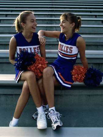 Two Cheerleaders Sitting with Pom-Poms Poster