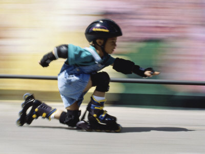 Boy on Rollerblades Crouching Poster
