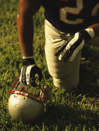 American Football Player Kneeling on the Field Poster