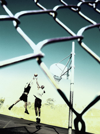 Low Angle View of Two Men Playing Basketball Behind a Chain-Link Fence Poster