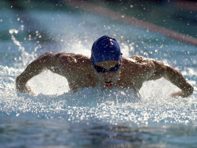 Young Man Swimming the Butterfly Stroke