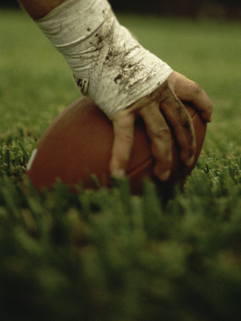 Buy Close-up of the Hand of an American Football Player Holding a Football at AllPosters.com
