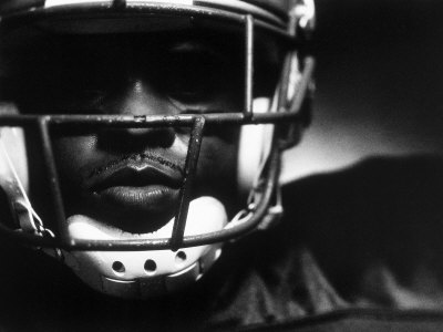 Close-up of an American Football Player Wearing a Helmet Poster