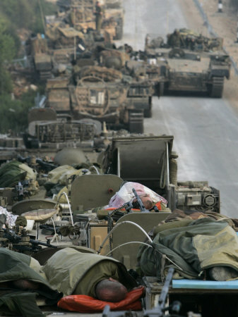 Israeli Soldiers Sleep on Top of Their Armored Vehicles
