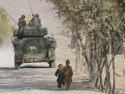 Afghan Boys Walk Along a Path While International Security Assistance Force (Isaf)
