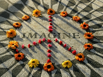 Buy A Makeshift Peace Sign of Flowers Lies on Top John Lennon's Strawberry Fields Memorial at AllPosters.com