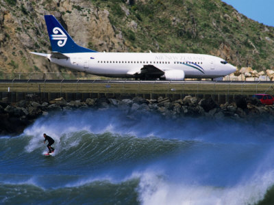 Surfer in "The Corner" Next to Airport Runway, Lyall Bay, Wellington, New Zealand Poster