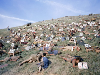 Extras Playing Dead People Hold Numbered Cards Between Takes During Filming of "Spartacus"