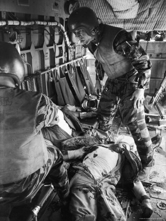 Helicopter Crew Chief James C. Farley with Wounded Pilot Lt. James Magel Lays Dying at His Feet