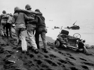 Wounded Marines Being Helped to Aid Station by Navy Corpsmen During WWII