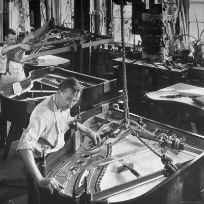 Workmen Installing Steel String Frames Into Grand Piano Cabinets at Steinway Piano Factory
