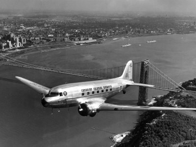 Canadian Colonial Airways Passenger Plane Flys over George Washington Bridge in Montreal, Canada