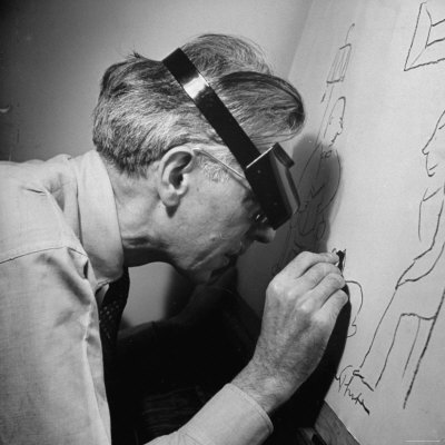 Cartoonist James Thurber, Wearing Magnification Glasses, at Work on One of His Cartoons