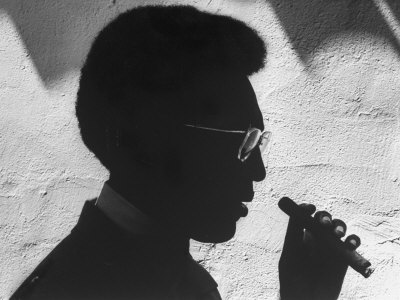 Silhouette of Actor/Comedian Bill Cosby with Cigar, Former Star of TV Series "I Spy"