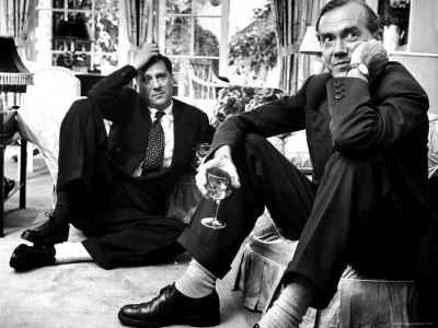 Film Director Carol Reed and Author Graham Greene Sitting on the Floor with Wine Glasses Poster