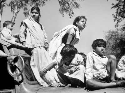 Children Watch Funeral Procession of Assassinated Indian Leader Mohandas K. Gandhi