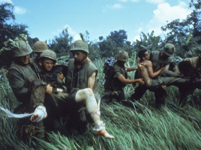 Members of 1st Marine Division Carrying Wounded During Firefight During Vietnam War. South Vietnam