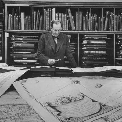 Harvard University Professor Sammuel Eliot Morison Studying a Map in One of Harvard