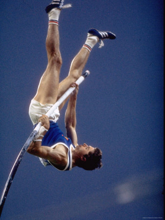 East Germany's Wolfgang Nordwig in Action During Pole Vaulting Event at the Summer Olympics