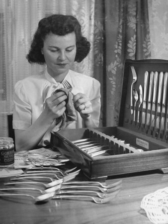 Housewife/Doll Factory Worker Josephine Gloss Polishing Her Fifty Piece Set of Silver Tableware