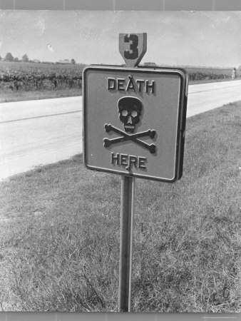 Skull and Crossbones Surrounded by the Words "Death Here" marking fatal car accident