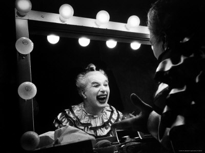 Charlie Chaplin at Dressing Room Mirror, Giving Himself a Wide Grin