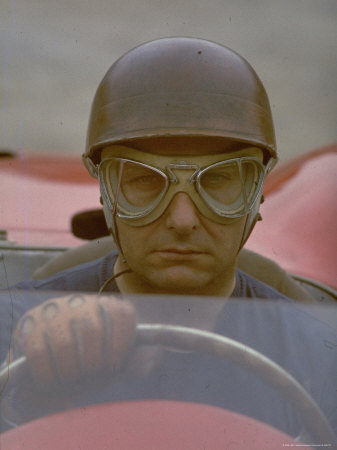 Argentine Auto Racer Juan Manuel Fangio Sitting at Wheel of Race Car at Las Mans