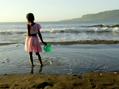 A Girl Walks on the Beach in Jacmel, Haiti, in This February 5, 2001