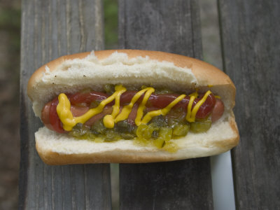 Buy A Hot Dog is Covered in Condiments Like Mustard, Ketchup and Relish at AllPosters.com
