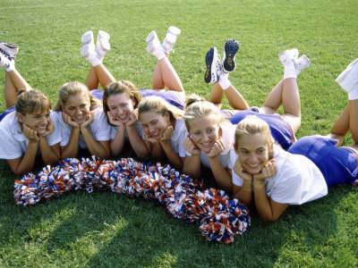 High Angle View of Cheerleaders Lying on a Lawn Poster