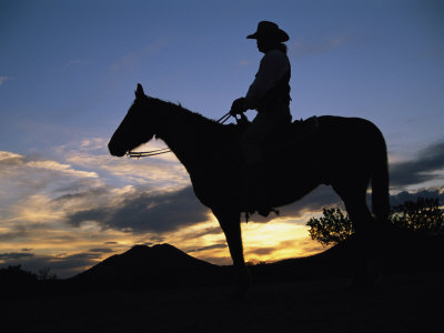 A Cowboy Silhouetted against a Sunset at This Western Movie Location