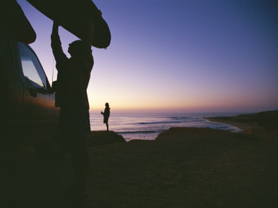 Buy A Surfer Unloads a Board at Dawn in East Cape of Baja, Mexico at AllPosters.com