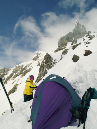 Buy A Hiker Sets up a Tent on a Snowy Ledge on Mount Hood at AllPosters.com