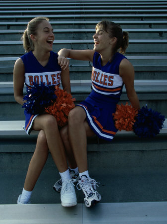 Two Cheerleaders Sitting with Pom-Poms Poster