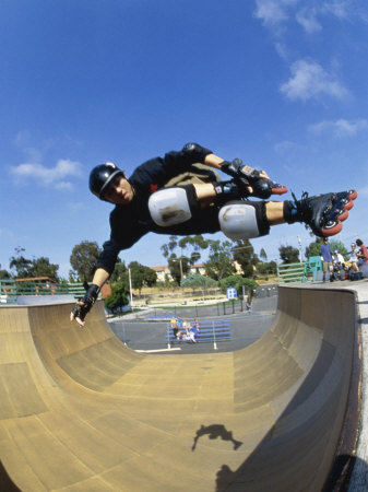 Rollerblader Perfoming Trick on Ramp Poster